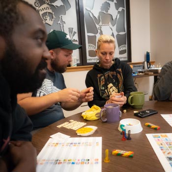 People sitting around a table playing a game