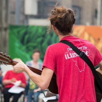 Playing guitar for outside worship time